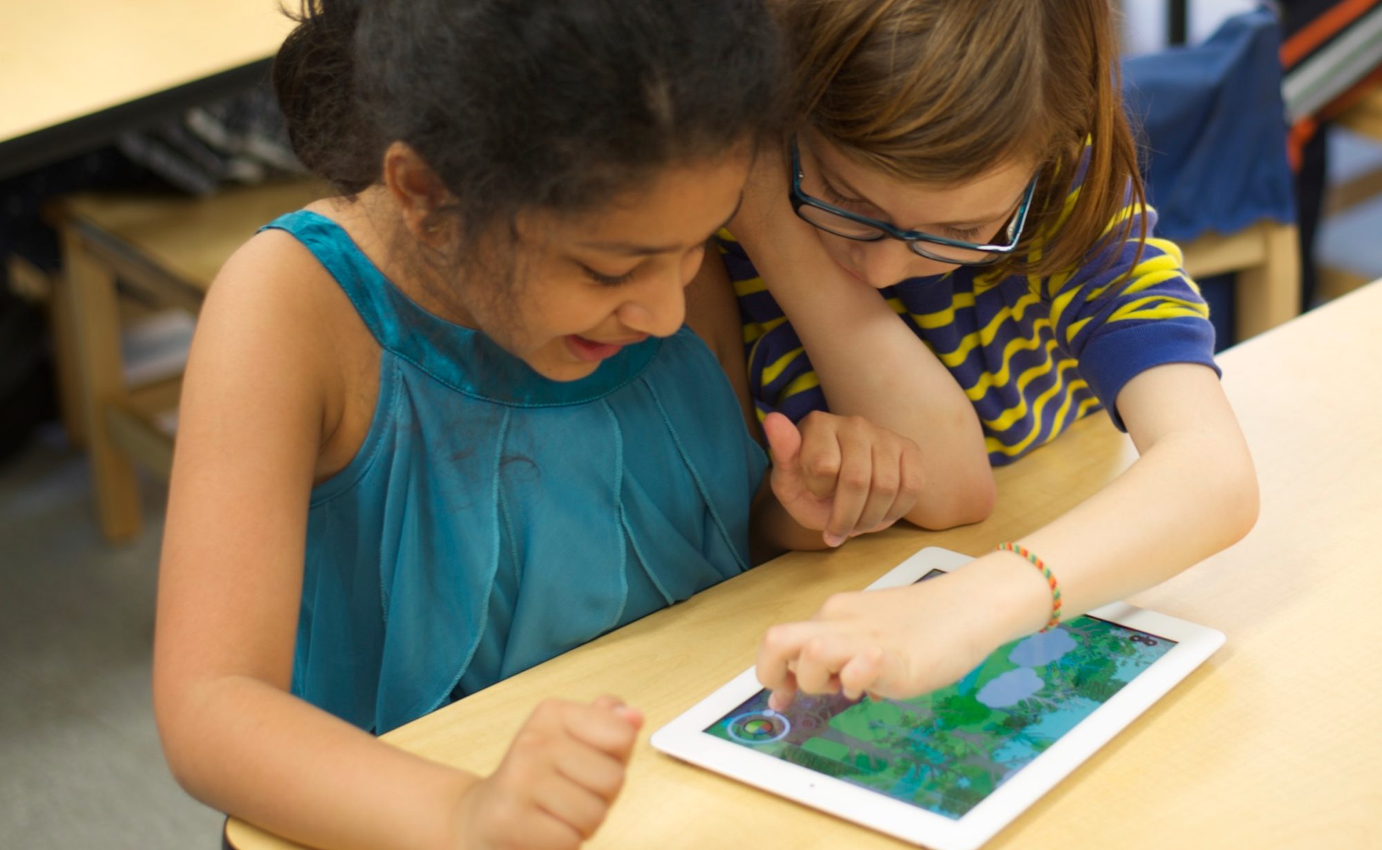 Kids playing Tinybop Plants. Photo Copyright Tinybop 2014