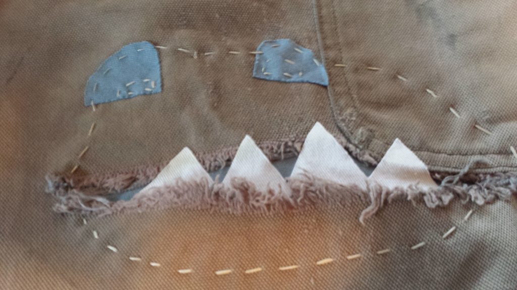 Hand sewing to ensure patches stay in place. (image: L. Weldon) 