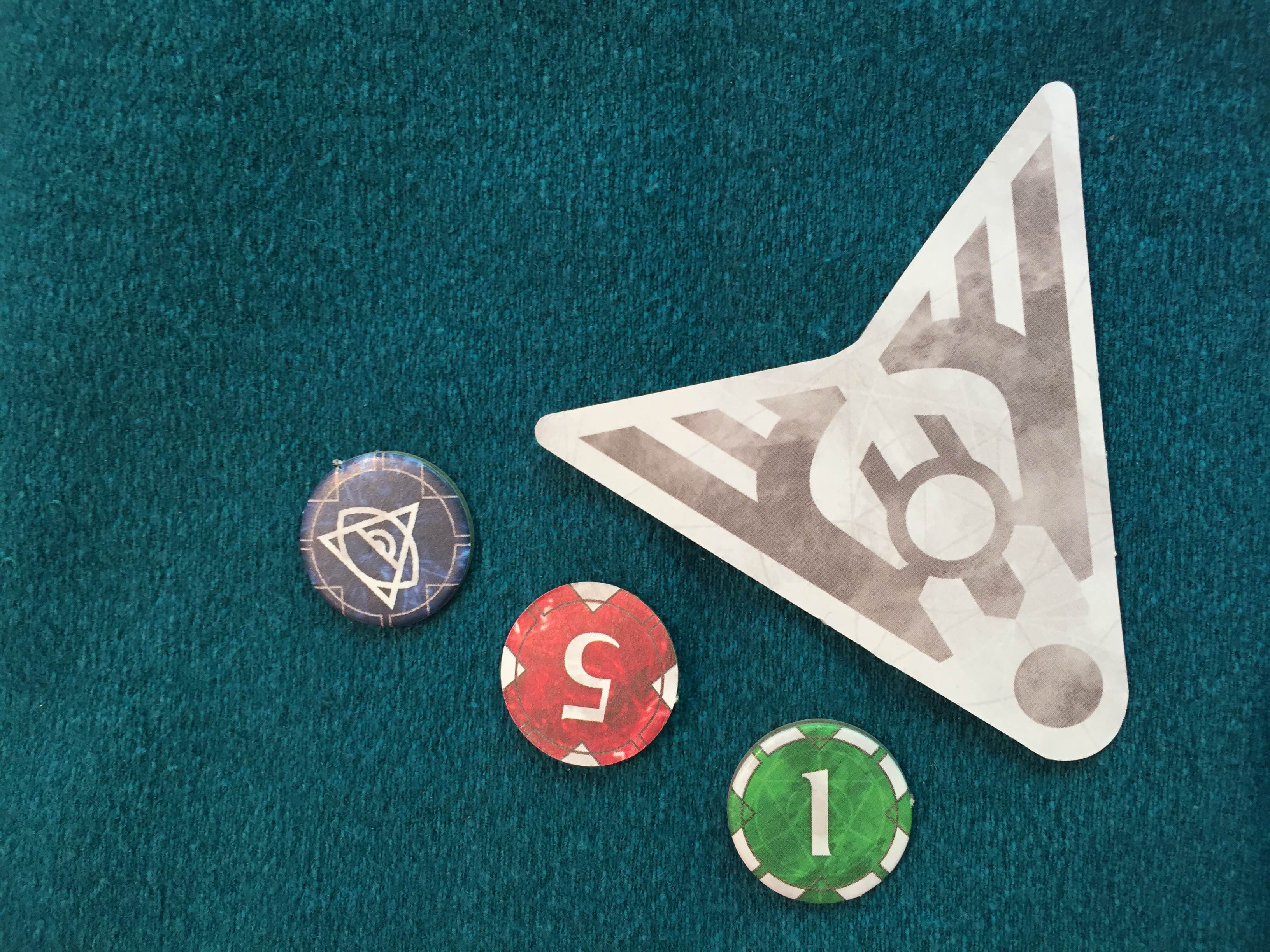 The first player token, and exhaustion, wound/damage and status markers.