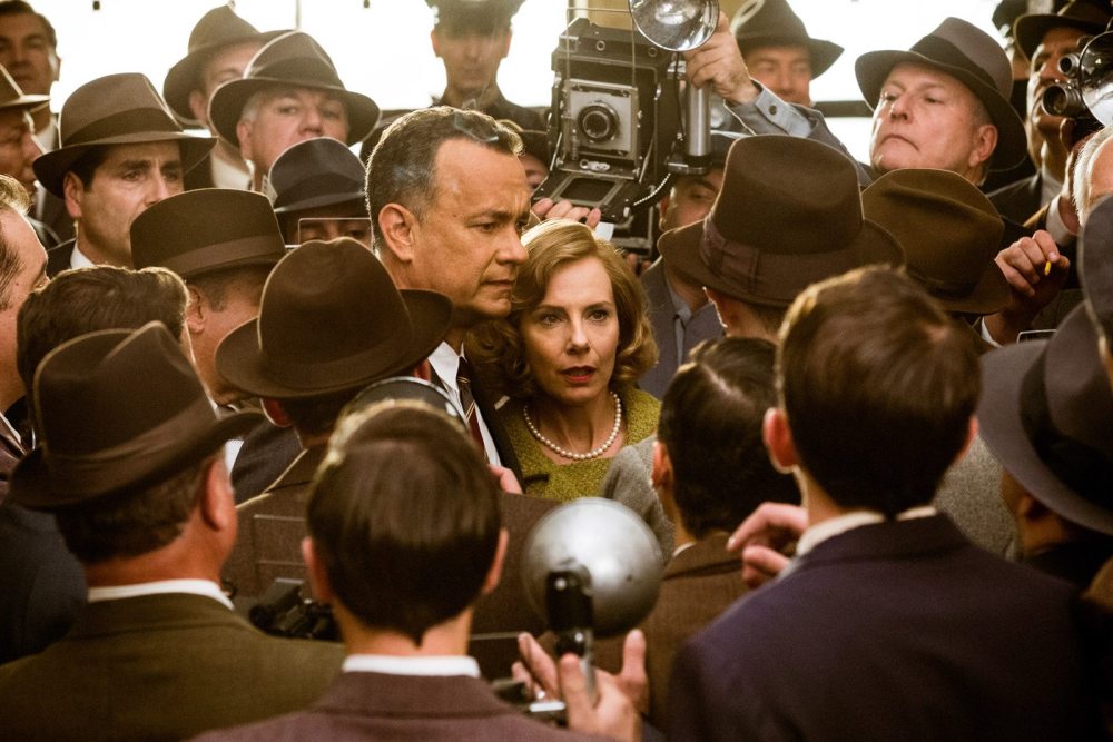 Donovan (Tom Hanks) and his wife Mary (Amy Ryan) are hounded by the press following the conviction of Rudolf Abel (Mark Rylance) in Bridge of Spies.