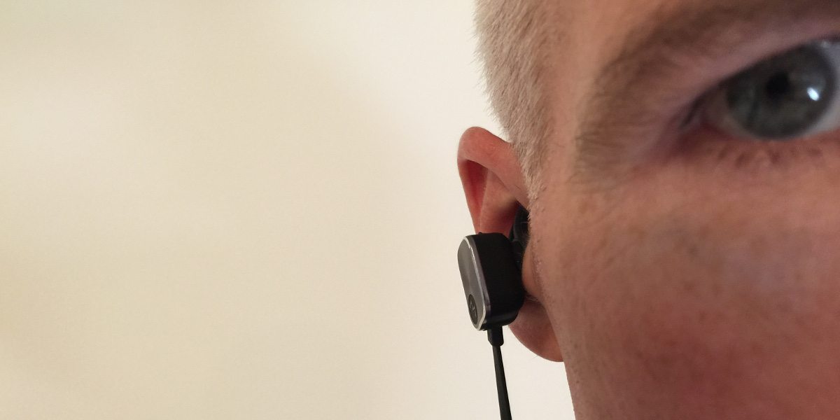 A close-up of my ear with the Magneto earbud sticking out a considerable distance.