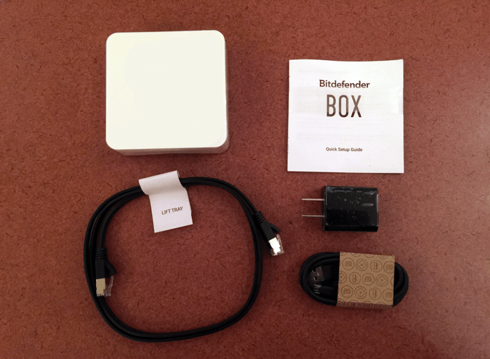 Contents of the Bitdefender BOX: Clockwise from top left. The BOX, Quickstart Guide, USB/AC converter, USB/Mini USB power supply, CAT 6 cable. Image: Rory Bristol