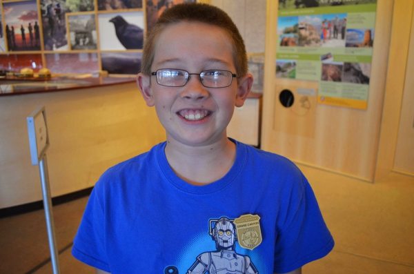 My then-9-year-old son showing off his newest National Park Service Junior Ranger badge. He has several. Photo: Patricia Vollmer