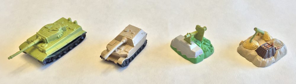 Base coat of paint on four different Memoir '44 miniatures.