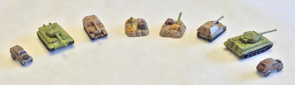 4 painted Memoir '44 miniatures from two angles each, having been washed with darker colors to bring out the detail.