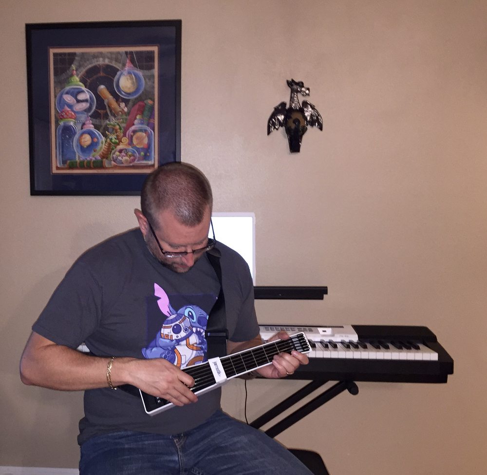 Plucking away with the Jamstik+ (Photo by Nora Owens)