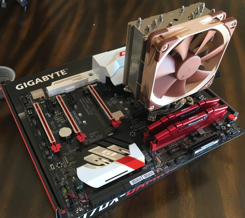 CPU, fan, and memory on a motherboard outside of the computer case.