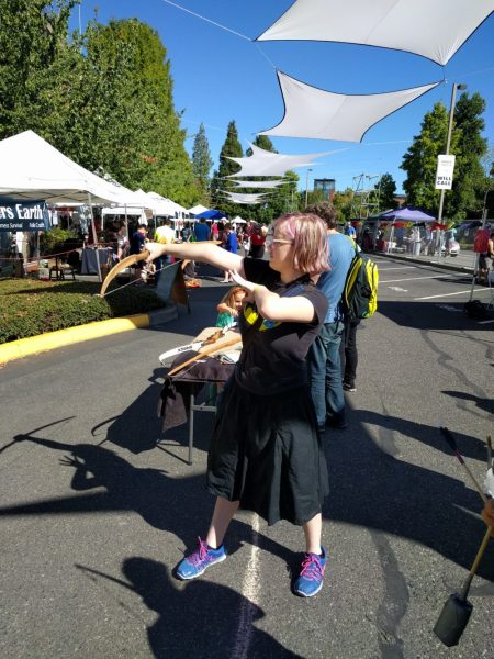 Demonstrating proper Nerf arrow technique at the Tracker PDX booth. 