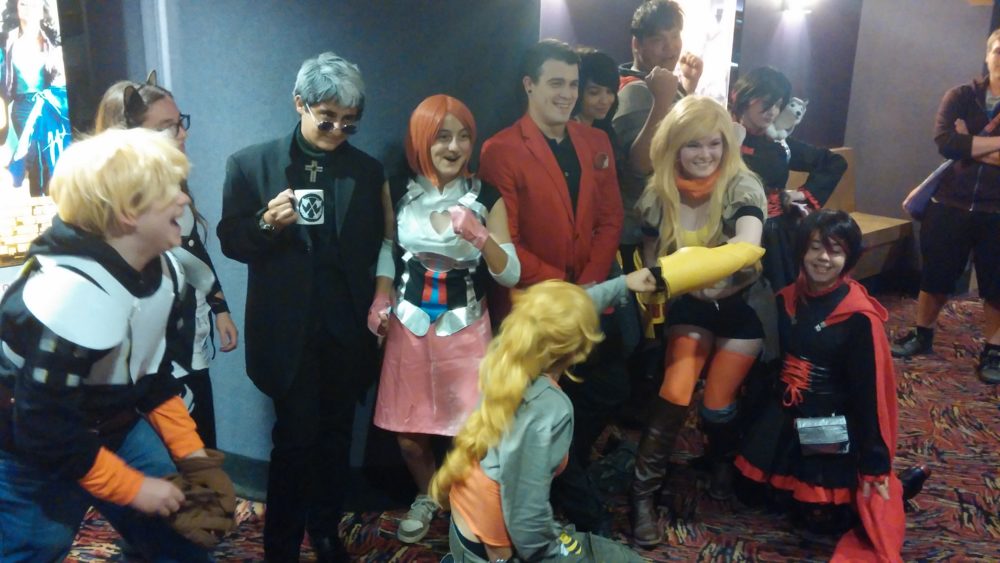 Cosplaying RWBY fans pose for group pics after the show.