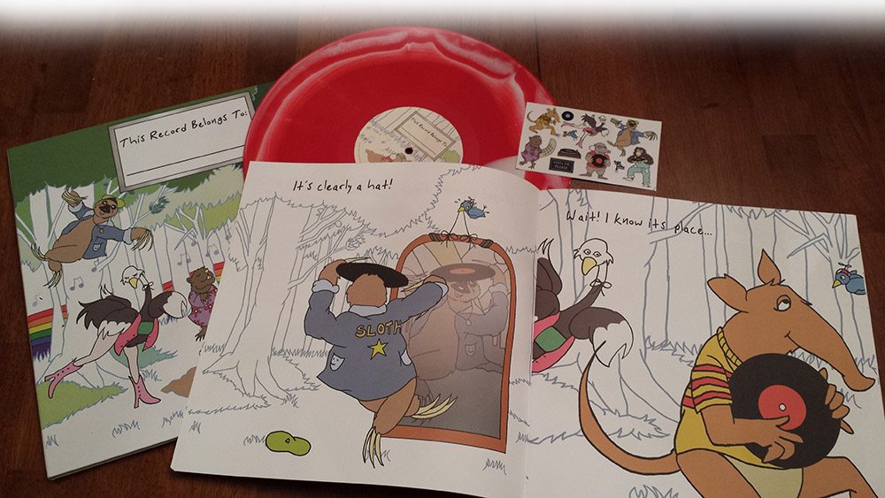 This limited, numbered pressing comes with the unique red & white record, book, and sticker set