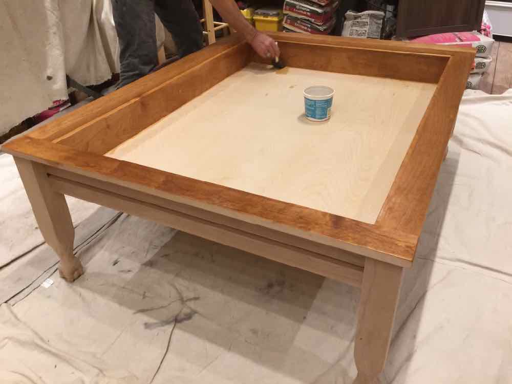 Applying finish to the gaming table