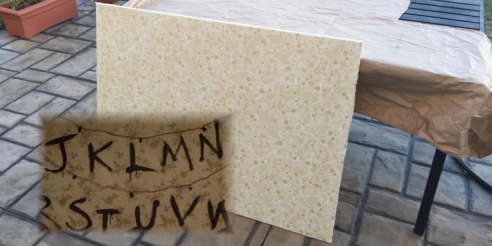 The fabric used to make the wallpaper compared to an inset from the show 'Stranger Things'.