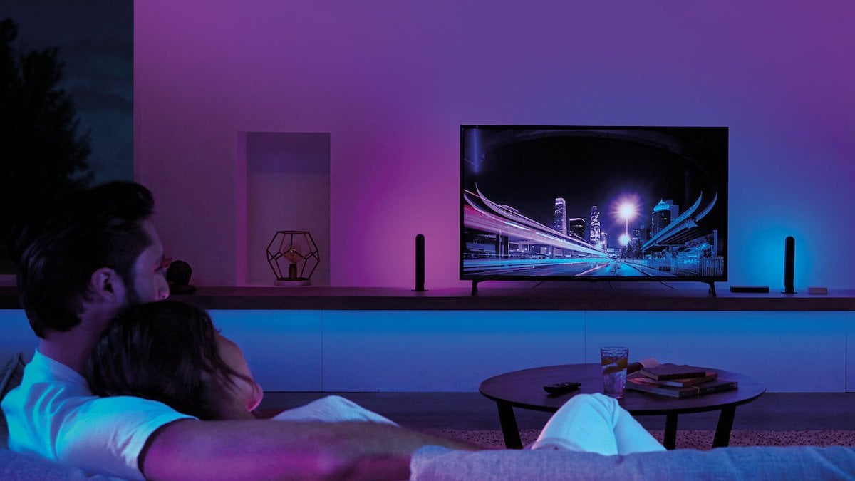 Sync your lights with your TV and the Philips Hue Play HDMI Sync Box to create seamless surround lighting.