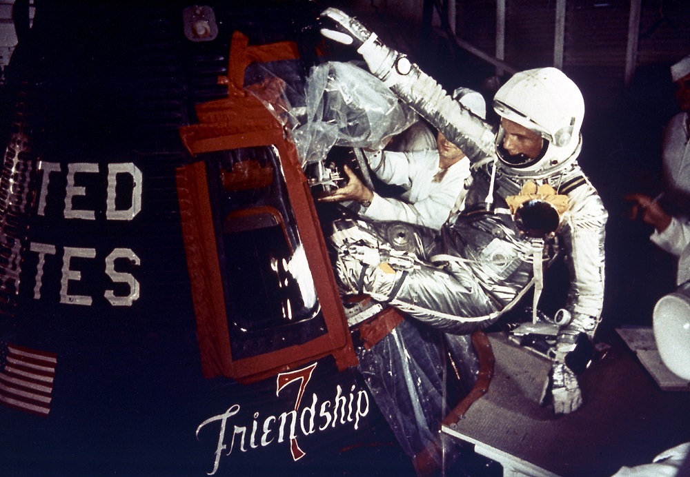 John Glenn climbing into space capsule.