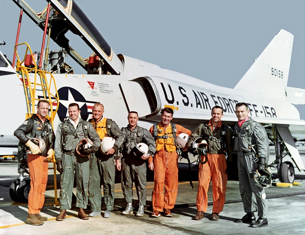 astronauts in front of jet fighter