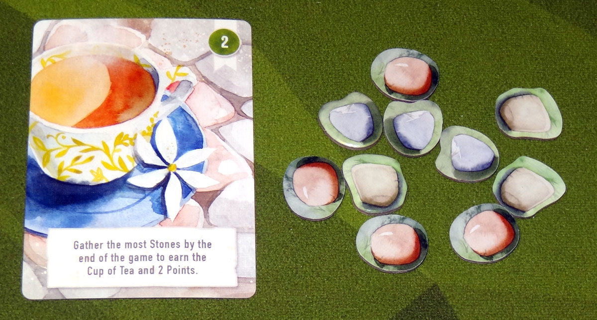 Floriferous cup of tea and stones