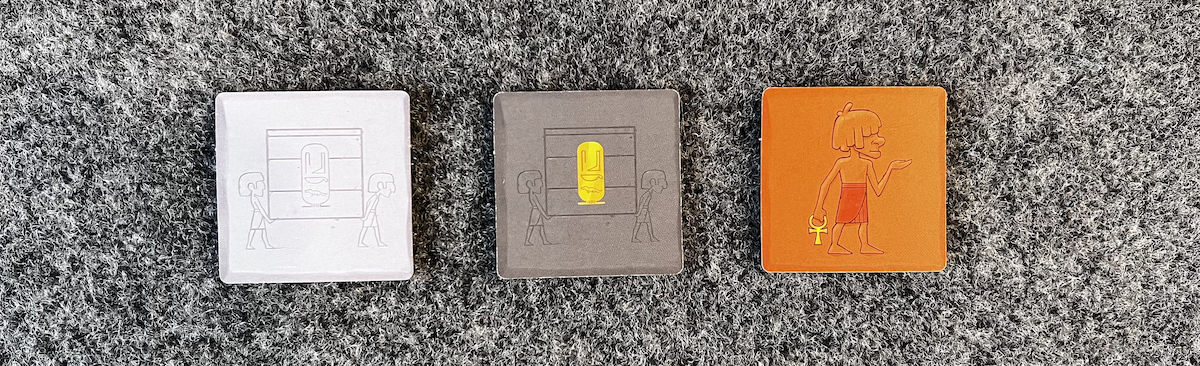 Top down view of the three different-colored backs of tiles