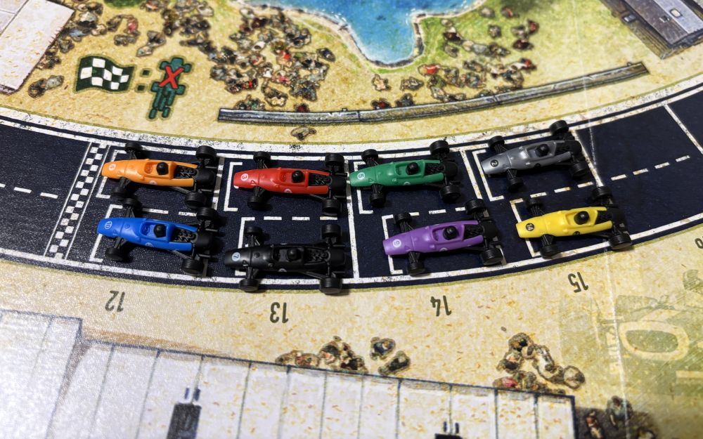 race cars on game board